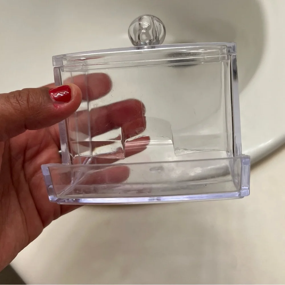 Clear cotton swab holder.